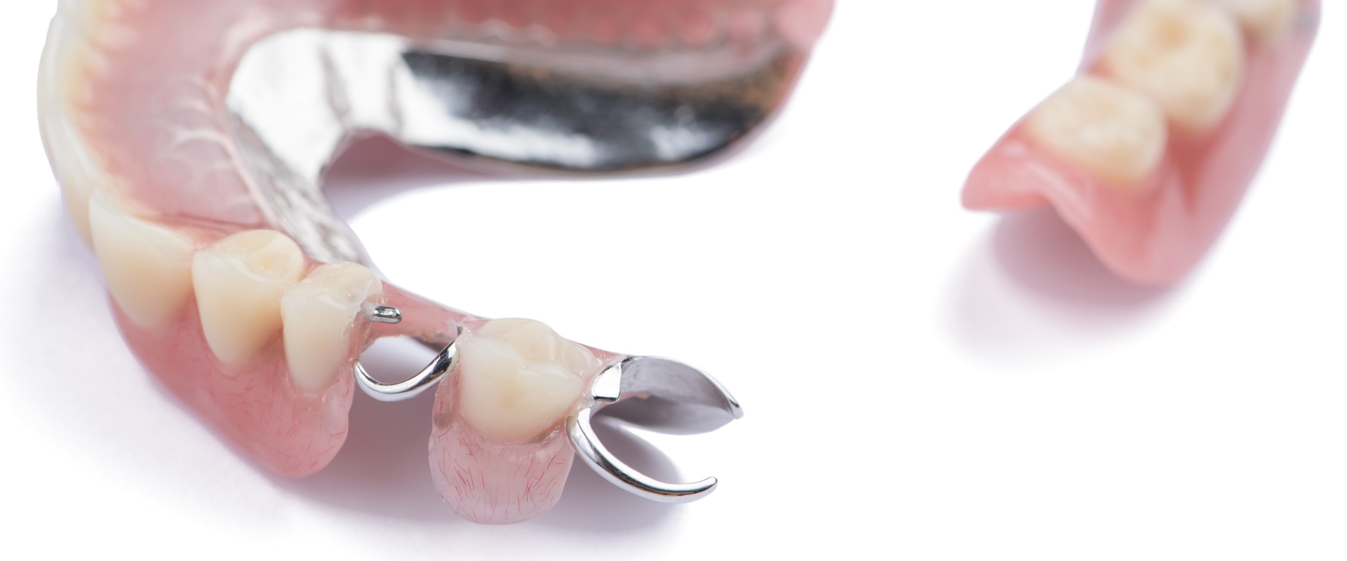 What is the difference between cosmetic dentures and regular dentures?